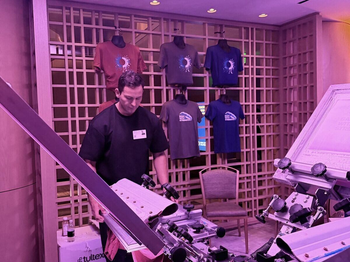 Heat press station at the Mobile T-Shirt Bar with tees staged and ready to print